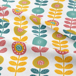 May include: White fabric with a repeating floral pattern. The design features stylized flowers in yellow, teal, and pink, with green leaves and stems. The flowers have circular and teardrop shapes, creating a retro, botanical theme.