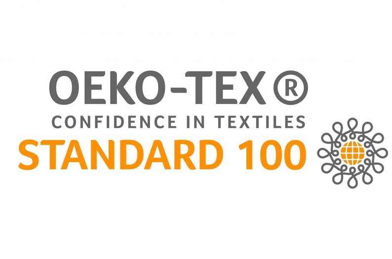 May include: The image shows the Oeko-Tex Standard 100 logo, a textile certification mark. The text reads "OEKO-TEX", "CONFIDENCE IN TEXTILES", and "STANDARD 100" in grey and orange. A decorative emblem is on the right side.