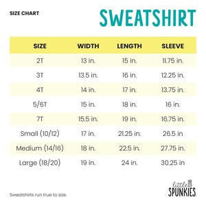 May include: A size chart for a sweatshirt with the text SWEATSHIRT and little SPUNKIES. The table lists sizes 2T through Large with corresponding width, length, and sleeve measurements in inches. The text states that sweatshirts run true to size.