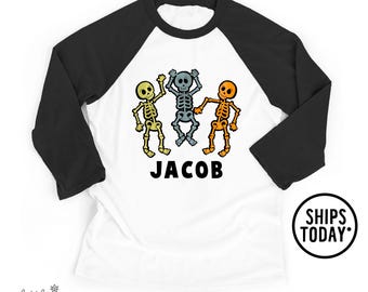 Toddler Halloween Raglan, Three Skeletons with Custom Name T-Shirt, Boys Halloween Graphic Tee - GL7966