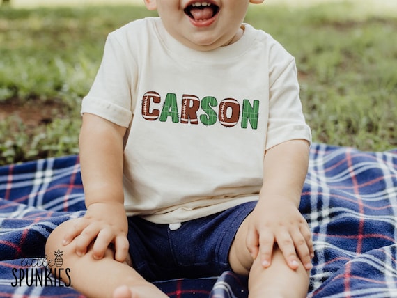 Kids Name Football Graphic Tee: Customizable Football & Field Alphabet Letters Shirt - XL25016