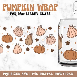 May include: A clear 16oz Libbey glass with a pumpkin wrap design. The wrap features various pumpkins in shades of brown and peach, along with brown leaves and diamond shapes. The text "PUMPKIN WRAP FOR 16oz LIBBEY GLASS" is displayed at the top.