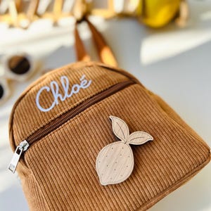 Personalized corduroy small backpack with lemon wood brooch