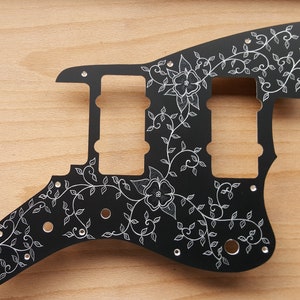 To fit Squier Affinity Jazzmaster, hand engraved  pickguard in gold, black anodised aluminium, totally hand made