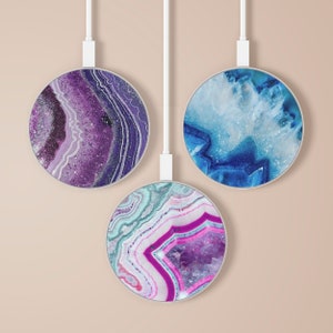 May include: Three round wireless charging pads with agate designs. The pads are purple, blue, and pink with white and silver accents.