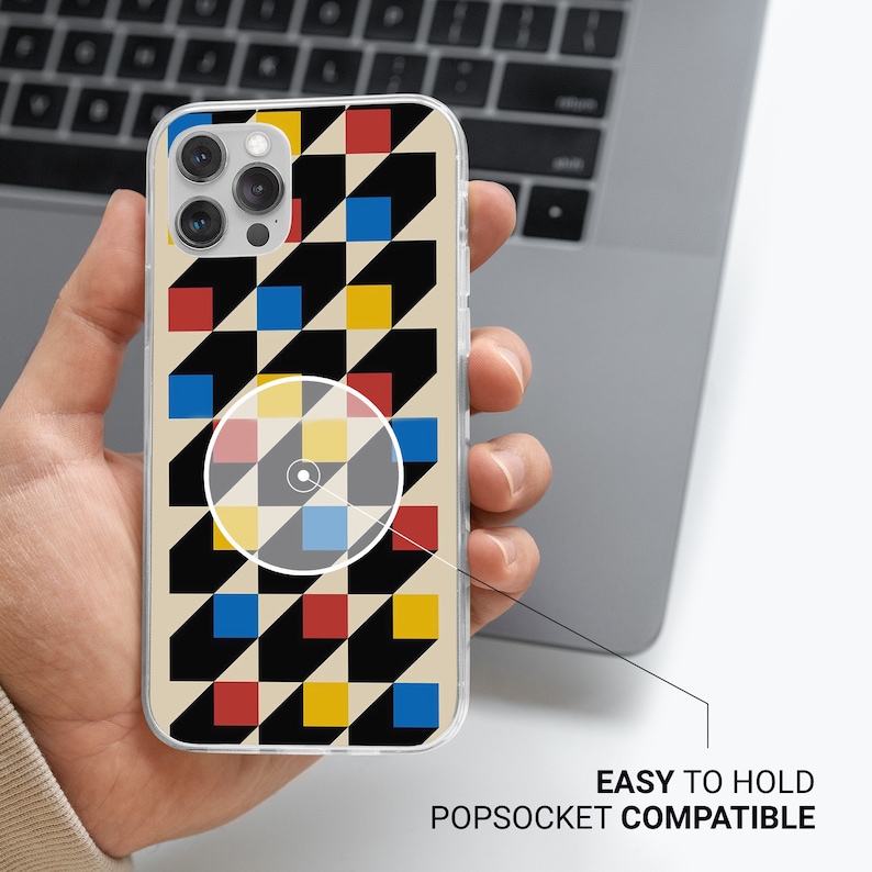 May include: A clear phone case with a geometric pattern of black, red, yellow, and blue squares. The case is compatible with PopSockets.