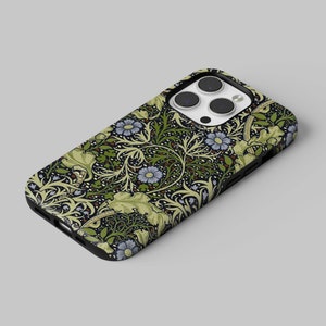 May include: A black phone case featuring a floral pattern with blue flowers, green leaves, and a dark background. The case has a glossy finish and a camera cutout.