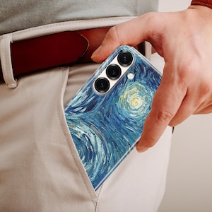 May include: A smartphone case featuring a reproduction of the Starry Night painting with swirling blue, yellow, and white brushstroke patterns. The case has three circular camera lens cutouts at the top and is partially inserted into a pocket.