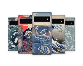 May include: A collection of five phone cases featuring Japanese-inspired art. The cases display various designs, including ocean waves, a dragon, and landscapes, in shades of blue, red, and beige. The cases are rectangular with camera cutouts.
