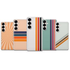 May include: Five smartphone cases arranged in a row, each featuring a distinct design. Patterns include orange sunburst rays, horizontal stripes in navy and orange, vertical stripes in red and black, teal with purple stripes, and diagonal brown stripes.