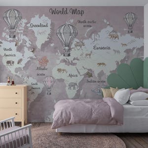 May include: A bedroom with a world map mural featuring hot air balloons, animals, and ocean names. The room includes a bed with a green headboard, a dresser, a chair, and a lamp. The color scheme is soft, with pinks, greens, and creams.