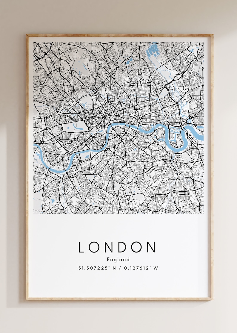 May include: A black and white map of London, England, with the city's name and coordinates printed below. The map shows the Thames River and surrounding streets.