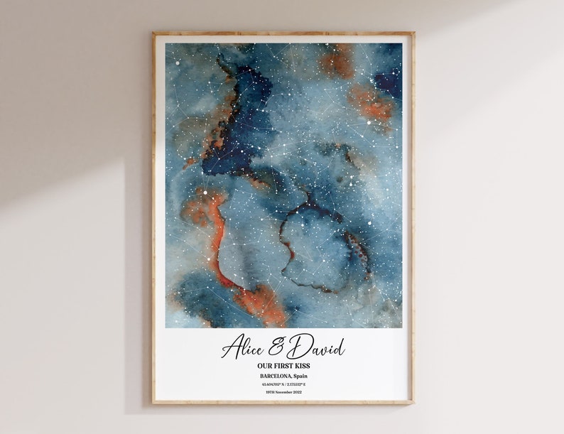 May include: A watercolor print of a starry night sky with a constellation map. The print features the names "Alice & David" and the text "Our First Kiss, Barcelona, Spain, 41.3851&deg; N, 2.1734&deg; E, 19th November 2020."