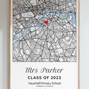May include: A framed map print of London, England, with a red heart marking a location. The print includes the text "Mrs Parker CLASS OF 2023" and "best teacher ever". The map is in black and white with a light blue river.