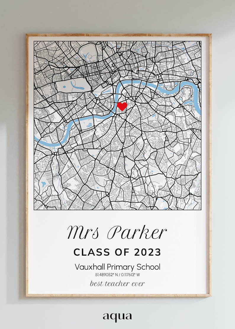 May include: A framed map print of London, England, with a red heart marking a location. The print includes the text "Mrs Parker CLASS OF 2023" and "best teacher ever". The map is in black and white with a light blue river.