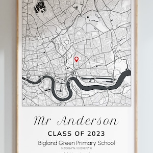 May include: A framed map print featuring a detailed black and white map with a red marker. The print includes the text "Mr Anderson CLASS OF 2023" and "Bigland Green Primary School". The frame is a light wood color.