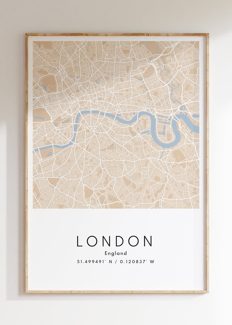 May include: A beige and blue map print of London, England. The map shows the city streets and the River Thames. The text below the map reads "LONDON, England, 51.499491&deg; N / 0.120837&deg; W".