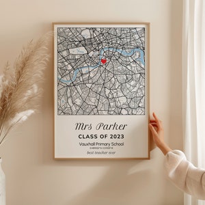 May include: Framed map print featuring a detailed black and white city map with a red heart marker. The print includes the text "Mrs Parker, Class of 2023, Vauxhall Primary School, 51.489062&deg; N / 0.10763&deg; W, best teacher ever."