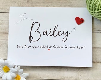May include: White card with black text that reads "Bailey gone from your side but forever in your heart". A red heart with a paw print is in the upper right corner.