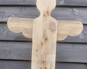 Robust angel made of weathered wood