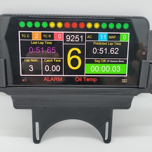 May include: A black 3D printed phone mount with a phone displaying a racing data app. The app shows a lap time of 0:51.65, a lap number of 3, a catch tank reading of 0.00, a speed of 9251, an AC reading of 11, a MAP reading of 0, a predicted lap time of 0:51.62, and a segment difference of 00:00.03.