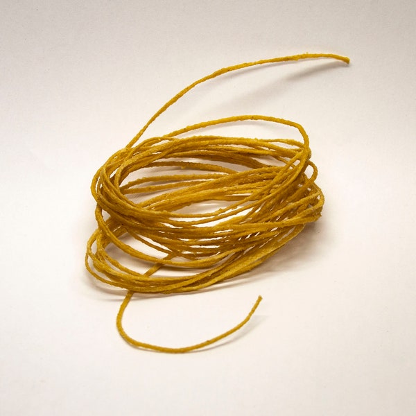 Wick of cotton, braided, annually impregnated with pure beeswax.