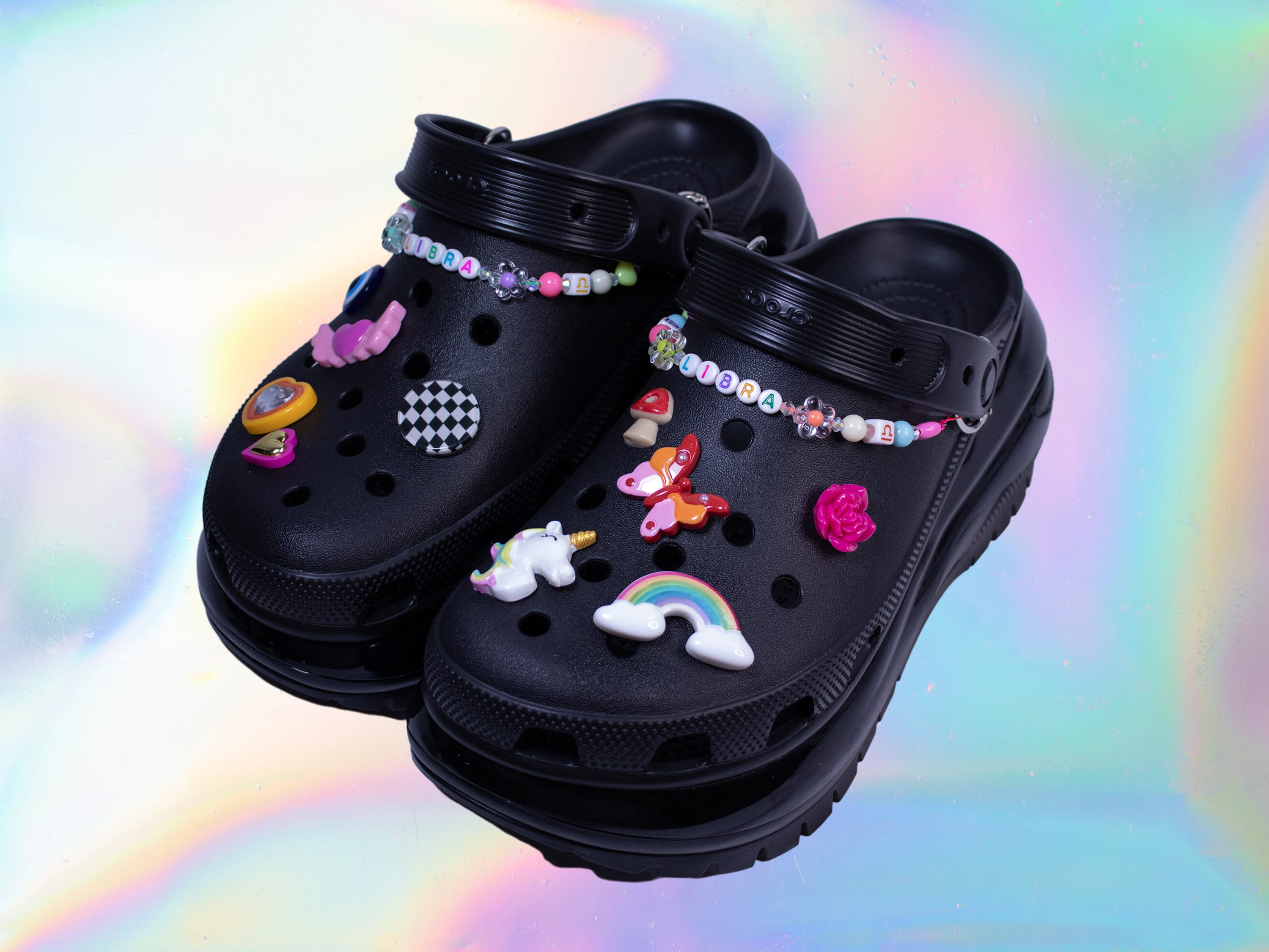 An  shop is selling black GOTH Crocs with studs, spikes, and chains for  $260