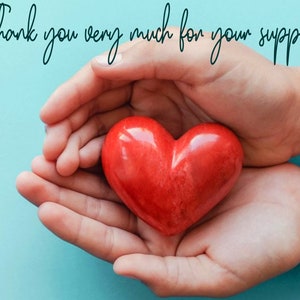 May include: A red heart-shaped object is held in cupped hands against a light blue background. The text "Thank you very much for your support" is written in cursive at the top.