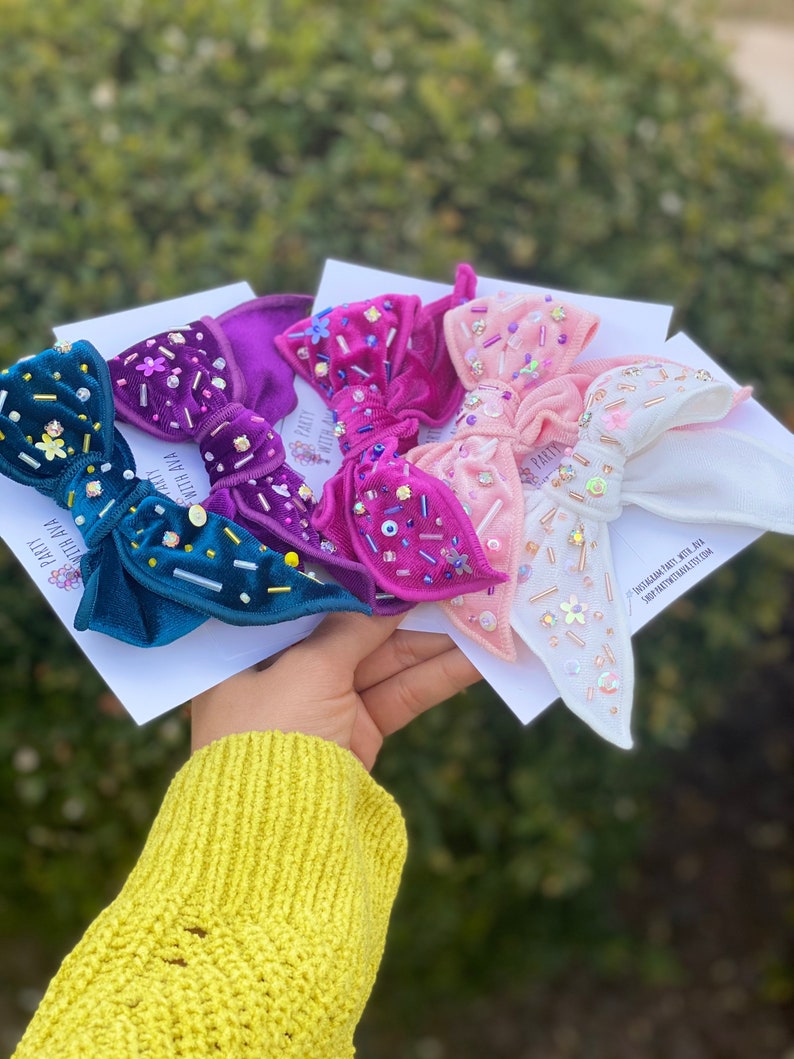Shiny velvet bowembellished bow