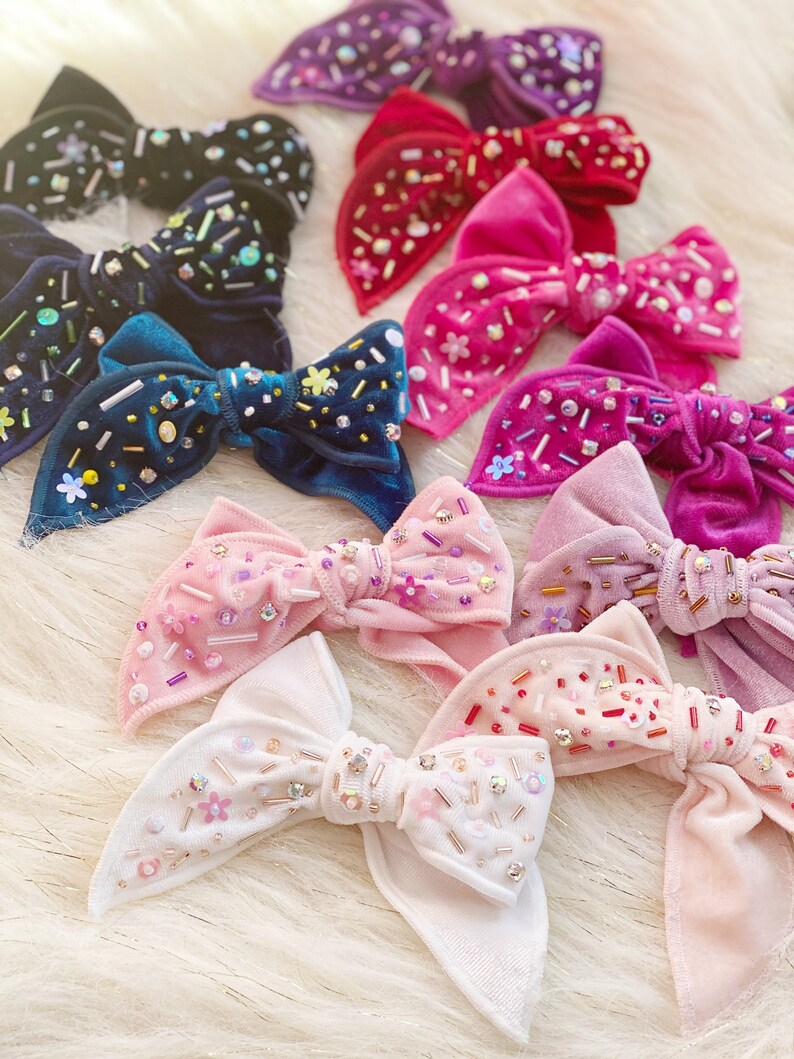 Shiny velvet bowembellished bow