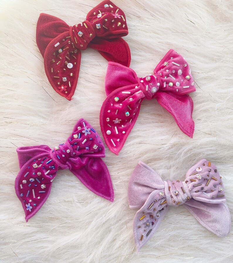 Shiny velvet bowembellished bow