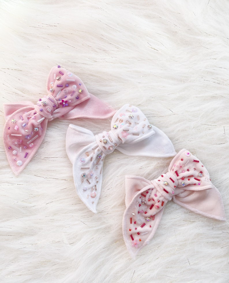 Shiny velvet bowembellished bow