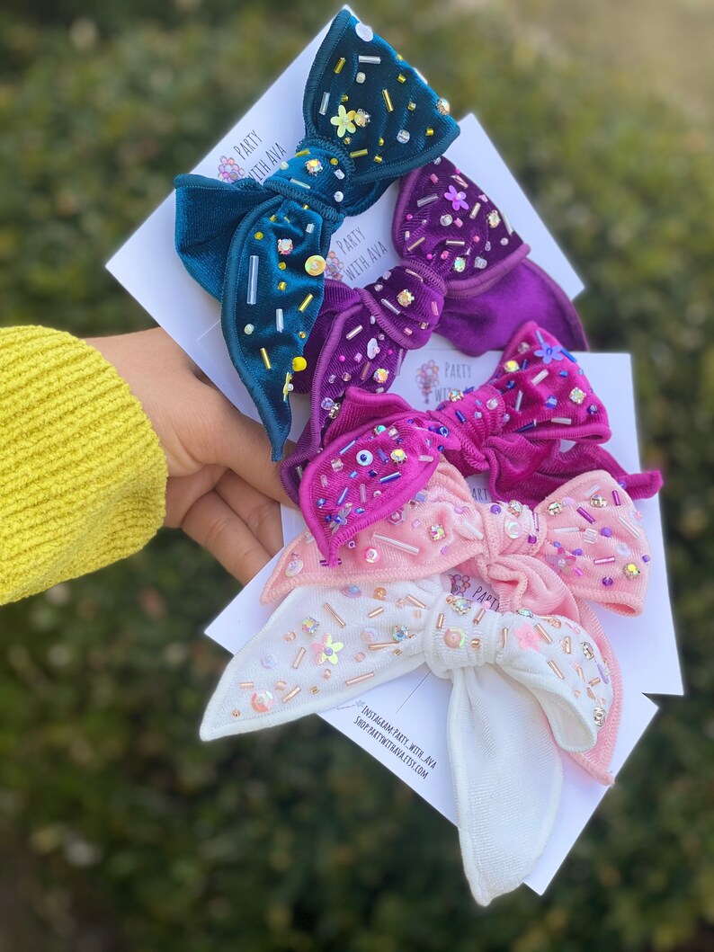 Shiny velvet bowembellished bow