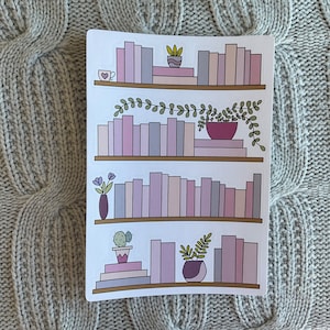 May include: A digital illustration of a bookshelf with four shelves filled with pink and purple books. Each shelf has a small plant or flower arrangement on it.