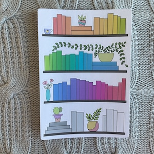 May include: A printable sticker sheet with three shelves of rainbow colored books, plants, and a cup of coffee. The shelves are white with a black outline.