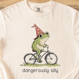 Camiseta divertida de rana, camiseta de rana mago caprichosa, regalo para amantes de las ranas, divertida camiseta de rana en bicicleta, color unisex cómodo