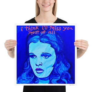 May include: A blue and white painting of a woman with the text "i think i'll miss you most of all" in red.