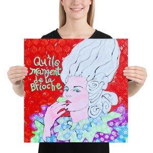 May include: A colorful painting of a woman with a large white wig, wearing a pink and green ruffled collar. The woman is holding a green cupcake and her mouth is open as if she is about to take a bite. The background is red with a floral pattern. The text "Qu'ils mangent de la brioche" is written in green and black letters.