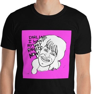 May include: Black t-shirt with a pink square graphic featuring a cartoon woman with the text "Darling I want my gay rights now".