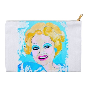 May include: A colorful illustration of a woman with blonde hair, blue eyes, and a bright smile. The background is a light blue with white accents.