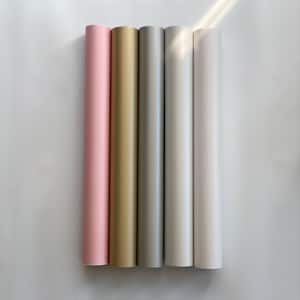 May include: Five rolls of adhesive vinyl in pink, gold, silver, white, and light gray.