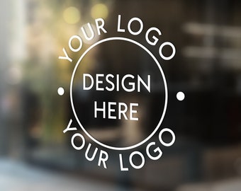 May include: White circular logo design on glass. The design features the text "YOUR LOGO" in a circular pattern, with "DESIGN HERE" in the centre. The background is blurred, suggesting an outdoor setting.