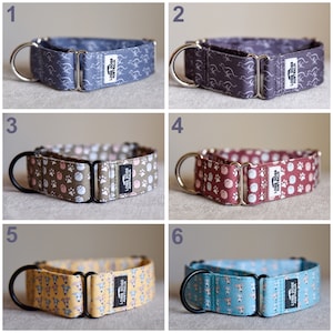 May include: Six different dog collars with various patterns, including paw prints, greyhounds, and a paw print design. The collars are made of fabric and have metal hardware. The collars are all labelled "Long Dogs Australia".