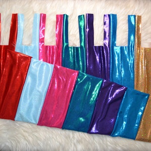 May include: A set of nine iridescent fabric bags with different colors, including red, blue, teal, purple, pink, and gold. The bags have a simple design with two handles.