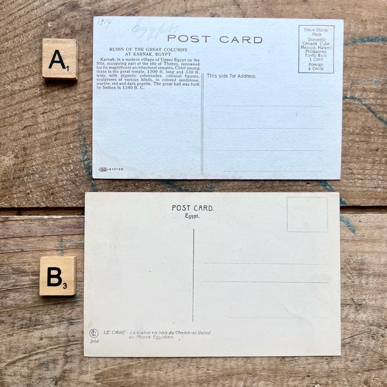May include: Vintage postcard featuring a black and white photo of the ruins of the Great Columns at Karnak, Egypt. The postcard is dated 1914 and has a place for a stamp and address.