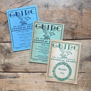 May include: Three vintage copies of "Guide: The Women's National Political Review" magazine. The covers are green, blue, and tan with an eagle graphic and the magazine title. The dates are March 1941, May 1941, and December 1941.