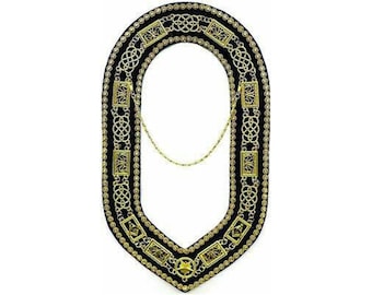 May include: A black velvet collar with gold chain and intricate gold embroidery. The collar is designed with a V-shaped opening in the front.