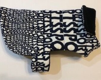 Reversible sport theme quilted fleece dog coat