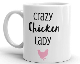 May include: White ceramic mug with black text that reads "crazy chicken lady" and a pink silhouette of a chicken.