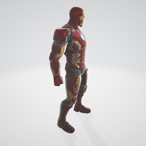 K&ouml;nnte beinhalten: Eine rote und goldene Iron Man Actionfigur mit detailliertem Metallic-Finish. Die Figur steht in einer Pose mit einem leicht nach vorne gerichteten Bein.